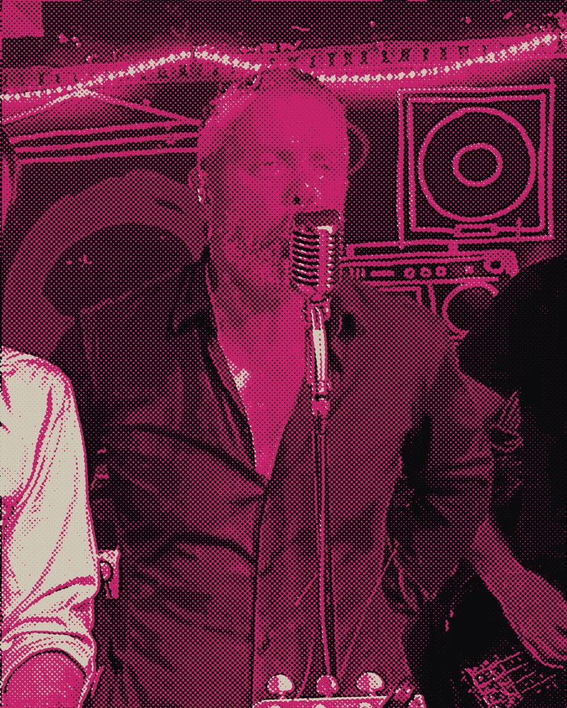 Tim singing into a vintage microphone
