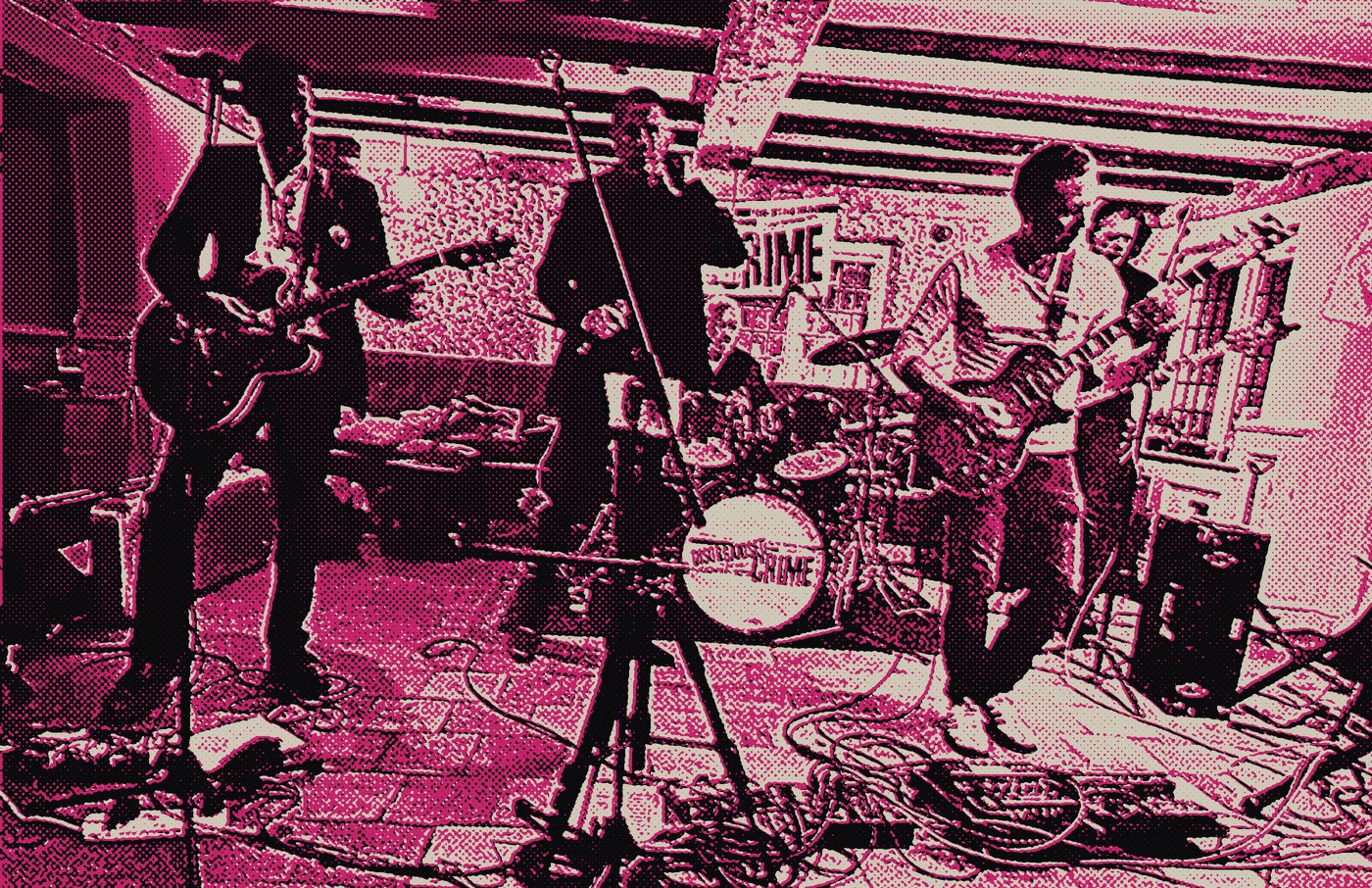 Disorganised Crime on stage: two guitarists, singer, drummer and bass player